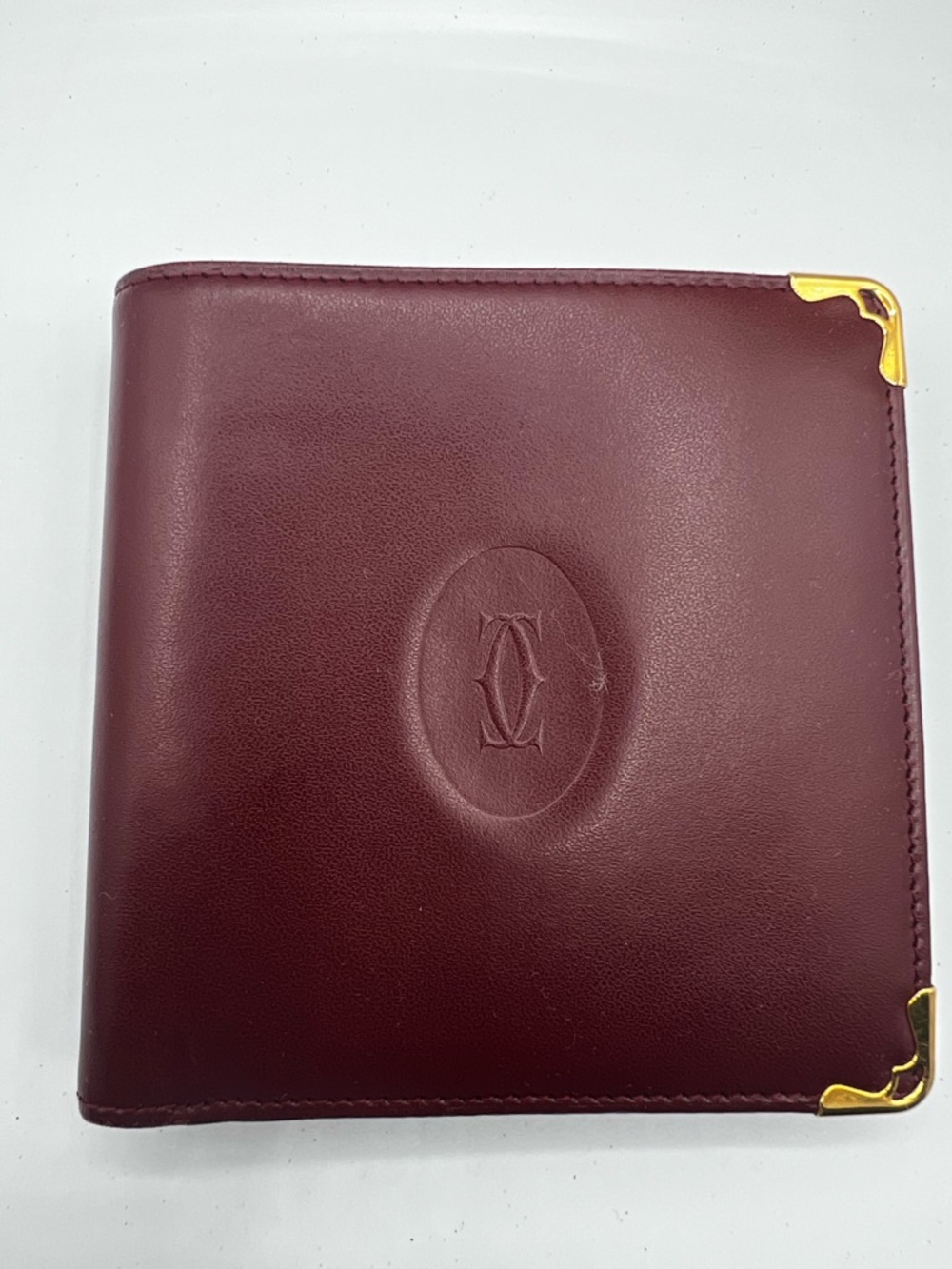 Cartier vintage Must de Cartier bifold wallet, crafted from burgundy calfskin